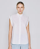 SLEEVELESS SHIRT WITH RHINESTONES